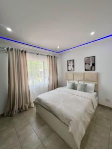 En eller flere senge i et værelse på Lux on Windermere 4 Bedroom House + 21 billeder