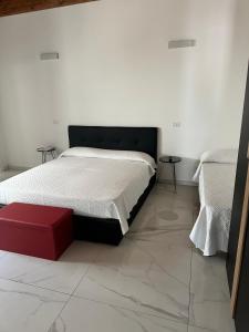 Postel nebo postele na pokoji v ubytování Villetta Lucia