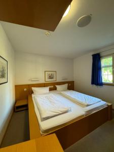 Postel nebo postele na pokoji v ubytování Pilgerhof und Rebmannshof
