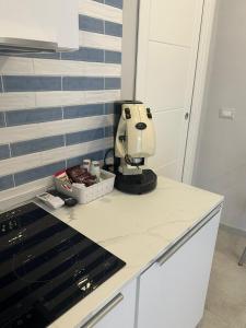 a mixer sitting on top of a kitchen counter at Casa Marigliano Formia in Formia +1 photo