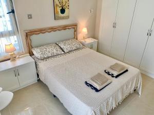 Postel nebo postele na pokoji v ubytování Boho Bay Apartment