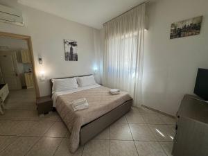 Postel nebo postele na pokoji v ubytování Residence VAPORE