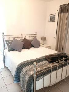 A bed or beds in a room at Bluview, Glyfada, Corfu