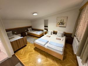Postel nebo postele na pokoji v ubytování Hostel Dino