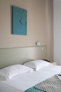 Posteľ alebo postele v izbe v ubytovaní Hotel Akropol