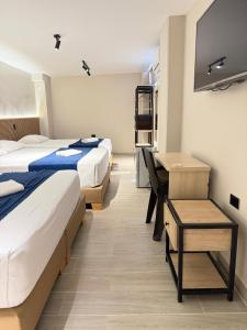 Postel nebo postele na pokoji v ubytování Hotel Suramericana