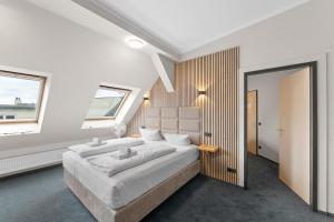 Postel nebo postele na pokoji v ubytování Hotel Comenius