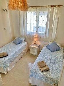 Postel nebo postele na pokoji v ubytování Boho Bay Apartment