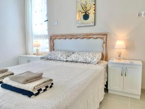 Postel nebo postele na pokoji v ubytování Boho Bay Apartment