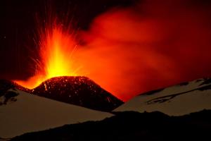 an eruption of a volcano with snow and lava at Etna Docet in Nicolosi