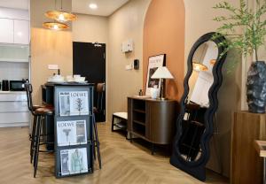 a dressing room with a mirror and a table at Amber Haus - deLofts Emporium - 4pax VH 13 in Kuching
