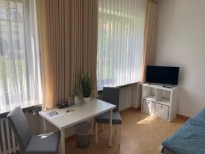 TV a/nebo společenská místnost v ubytování Klosterhof Neustadt am Main