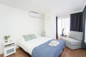 Postel nebo postele na pokoji v ubytování Natumi ホテル 304 高级独栋别墅 车站步行五分钟 成田-羽田-上野一线直达