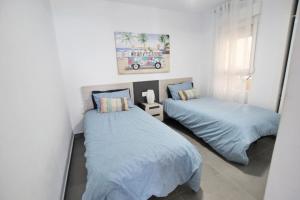 Postel nebo postele na pokoji v ubytování Apartamento Primera Línea Playa Centro de Guardamar