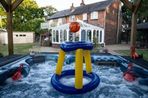 a pool with a basketball on top of it at East Sussex Manor - Sleeps 12 - Hot Tub & Parking in Hailsham