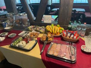 a table with many different types of food on it at Hotel Alt Nürnberg in MHG