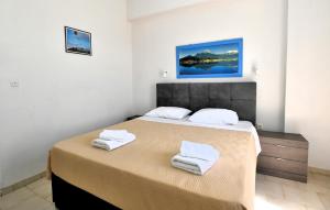 Postel nebo postele na pokoji v ubytování Vanas Apartments