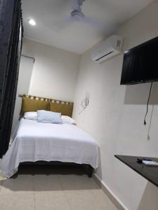 Llit o llits en una habitació de Dalia 1 foto més