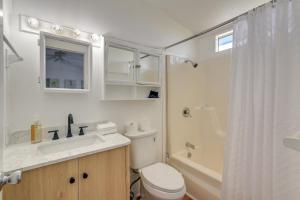 a bathroom with a toilet and a sink and a shower at Oceanfront Galveston Home on Terramar Beach in Galveston +25 photos