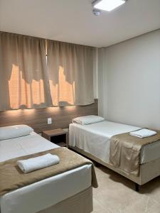 Un pat sau paturi într-o cameră la Hotel Accordes