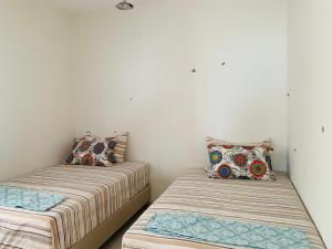 Cama ou camas em um quarto em Atlas Ocean View Vue Mer Directe