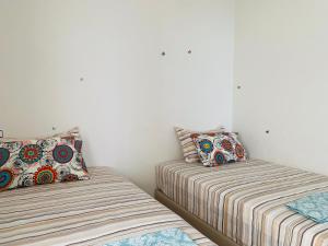 Cama ou camas em um quarto em Atlas Ocean View Vue Mer Directe