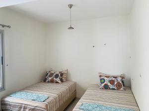 Cama ou camas em um quarto em Atlas Ocean View Vue Mer Directe