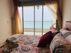 Cama ou camas em um quarto em Atlas Ocean View Vue Mer Directe