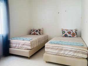 Cama ou camas em um quarto em Atlas Ocean View Vue Mer Directe