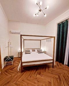 Ένα ή περισσότερα κρεβάτια σε δωμάτιο στο Virdimura Charming House