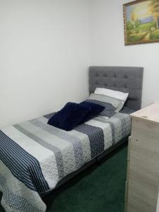 Postel nebo postele na pokoji v ubytování Innovar Casa Hostal