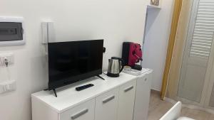 TV a/nebo společenská místnost v ubytování Casa Mo'