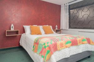 Postel nebo postele na pokoji v ubytování Innovar Casa Hostal