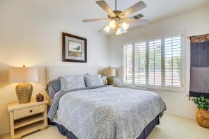 a bedroom with a bed and a ceiling fan at Resort-Style Amenities at Palm Desert Getaway in Palm Desert