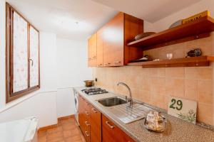 a kitchen with a sink and a counter top at Soggiornare in Valle Soana in Valprato Soana