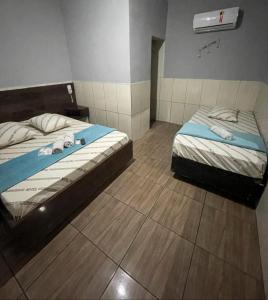 Postel nebo postele na pokoji v ubytování Hotel xandu-proximo arena corinthians