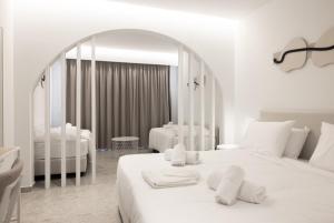 A bed or beds in a room at Aiora Resort