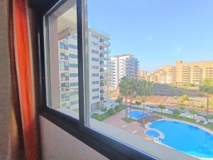 Der Swimmingpool an oder in der Nähe von Ayf 200m del mar 2 piscinas, pista de padel y gym