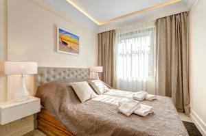 Postel nebo postele na pokoji v ubytování Bentley Home Sopot