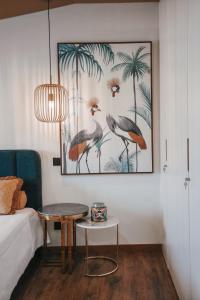 a room with a table and a picture on the wall at Casa da Veiga de Ponte de Lima in Ponte de Lima