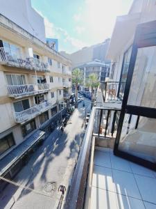 a view of a street from a balcony of a building at Lovely Paceville Studio G in St. Julianʼs