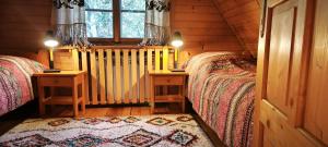 Łóżko lub łóżka w pokoju w obiekcie Domek Raj Zakopane