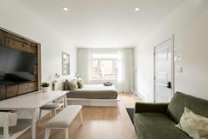 Ένα ή περισσότερα κρεβάτια σε δωμάτιο στο Appartements Les Havres de Limoilou