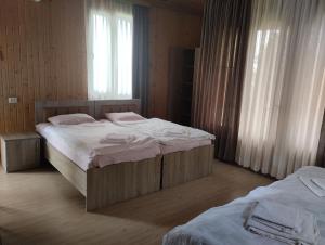 Postel nebo postele na pokoji v ubytování Guesthouse Achi
