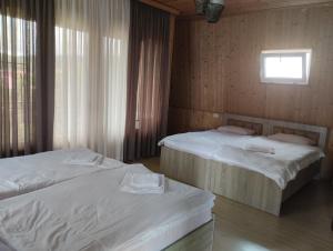 Postel nebo postele na pokoji v ubytování Guesthouse Achi