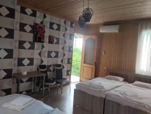 Postel nebo postele na pokoji v ubytování Guesthouse Achi