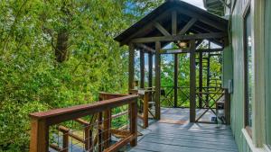 a wooden deck with a gazebo on a house at Mountain Retreat Ruby's Roost House in Mentone