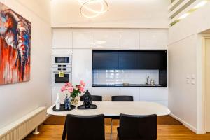 a kitchen and dining room with a table and chairs at On The Hill in Mytilene +26 photos