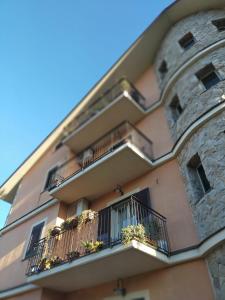 a building with balconies and potted plants on it at Etna House in Santa Maria di Licodia +43 photos