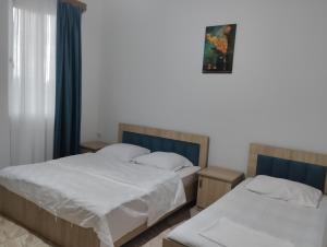 Postel nebo postele na pokoji v ubytování Guesthouse Achi